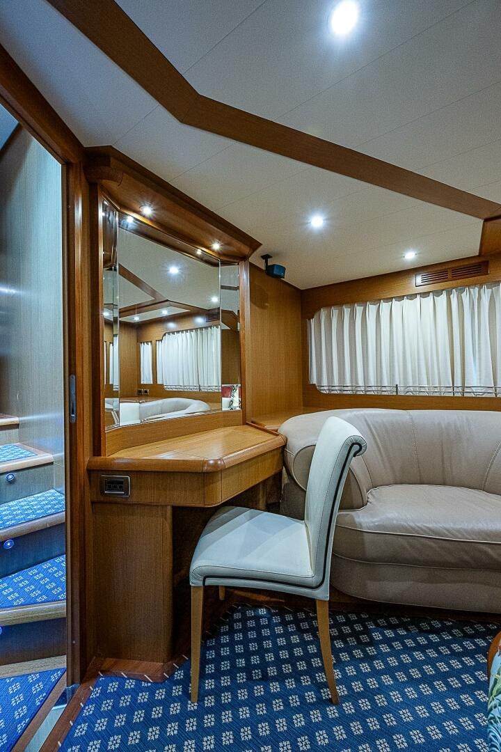 a bathroom with a mirror and a bed aboard KNOT NANNY'S Yacht for Sale