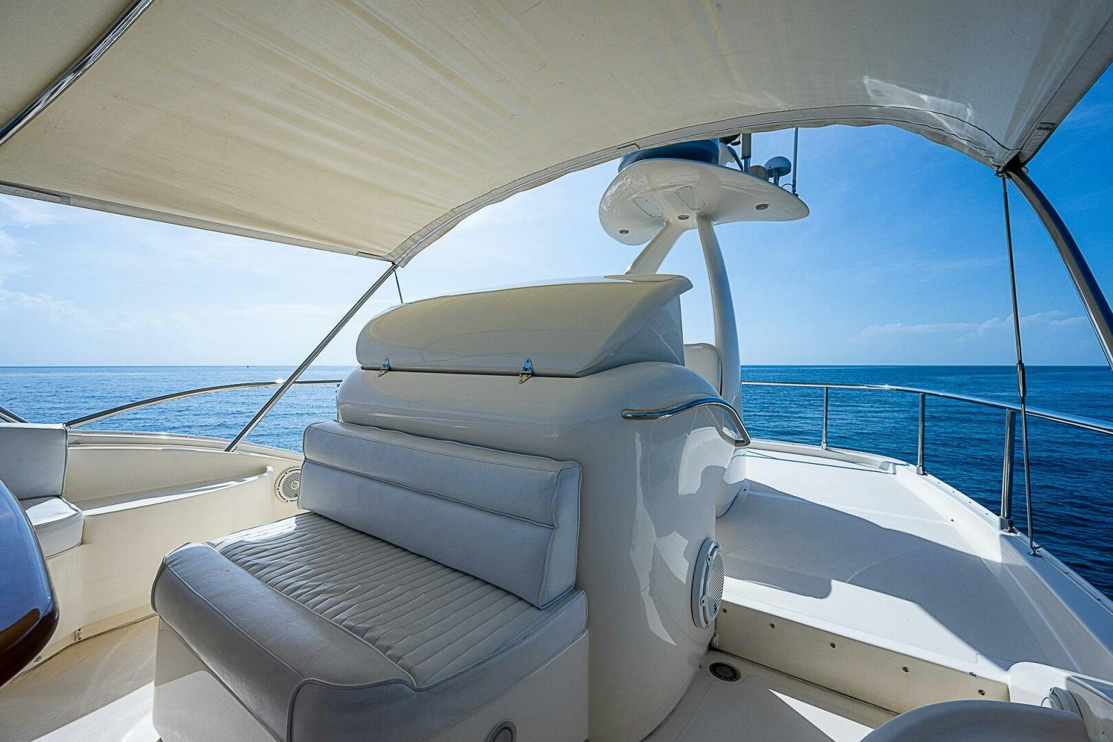 a boat with a seat and a fan on the deck aboard KNOT NANNY'S Yacht for Sale