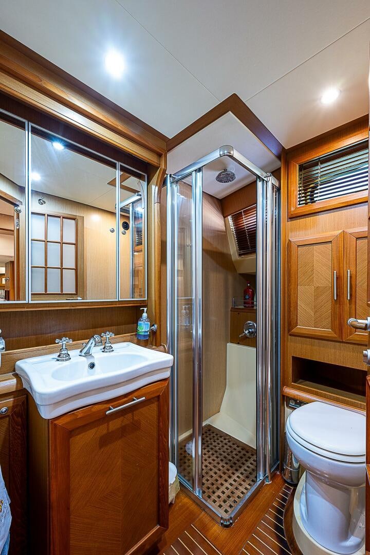 a bathroom with a stand up shower aboard KNOT NANNY'S Yacht for Sale