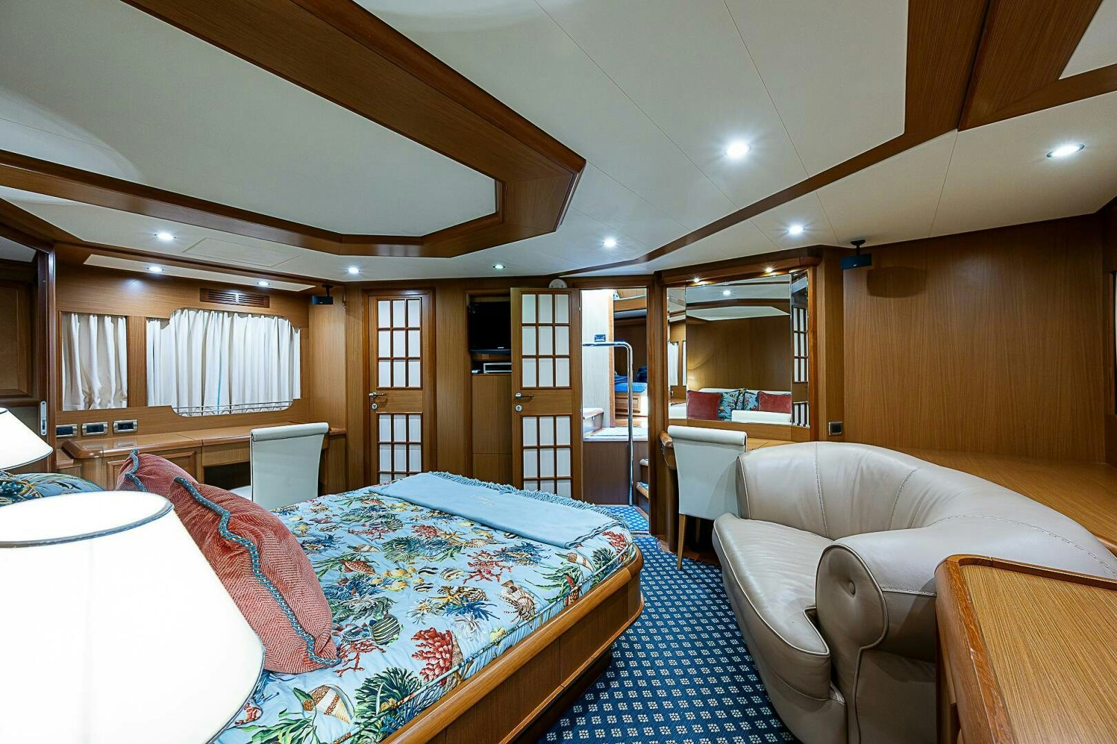 a bedroom with a bed and a couch aboard KNOT NANNY'S Yacht for Sale