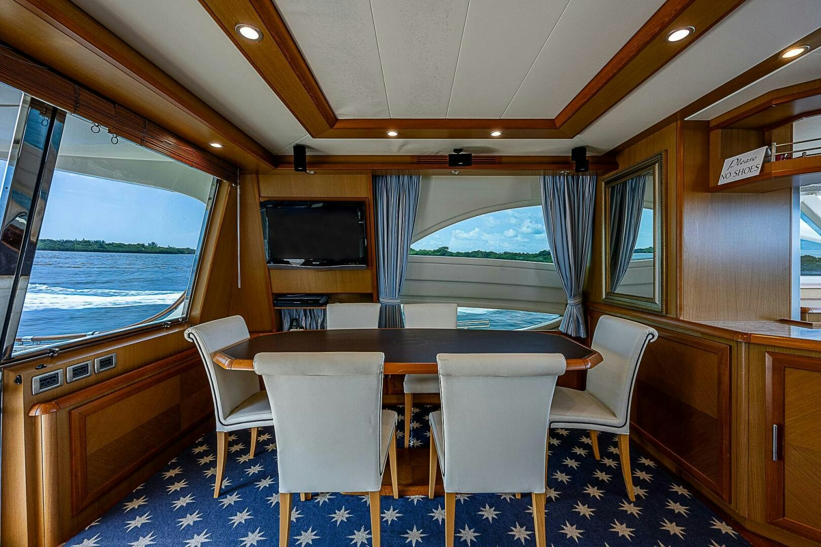 a table and chairs in a room aboard KNOT NANNY'S Yacht for Sale