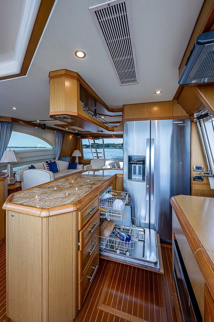 a kitchen with a large refrigerator aboard KNOT NANNY'S Yacht for Sale