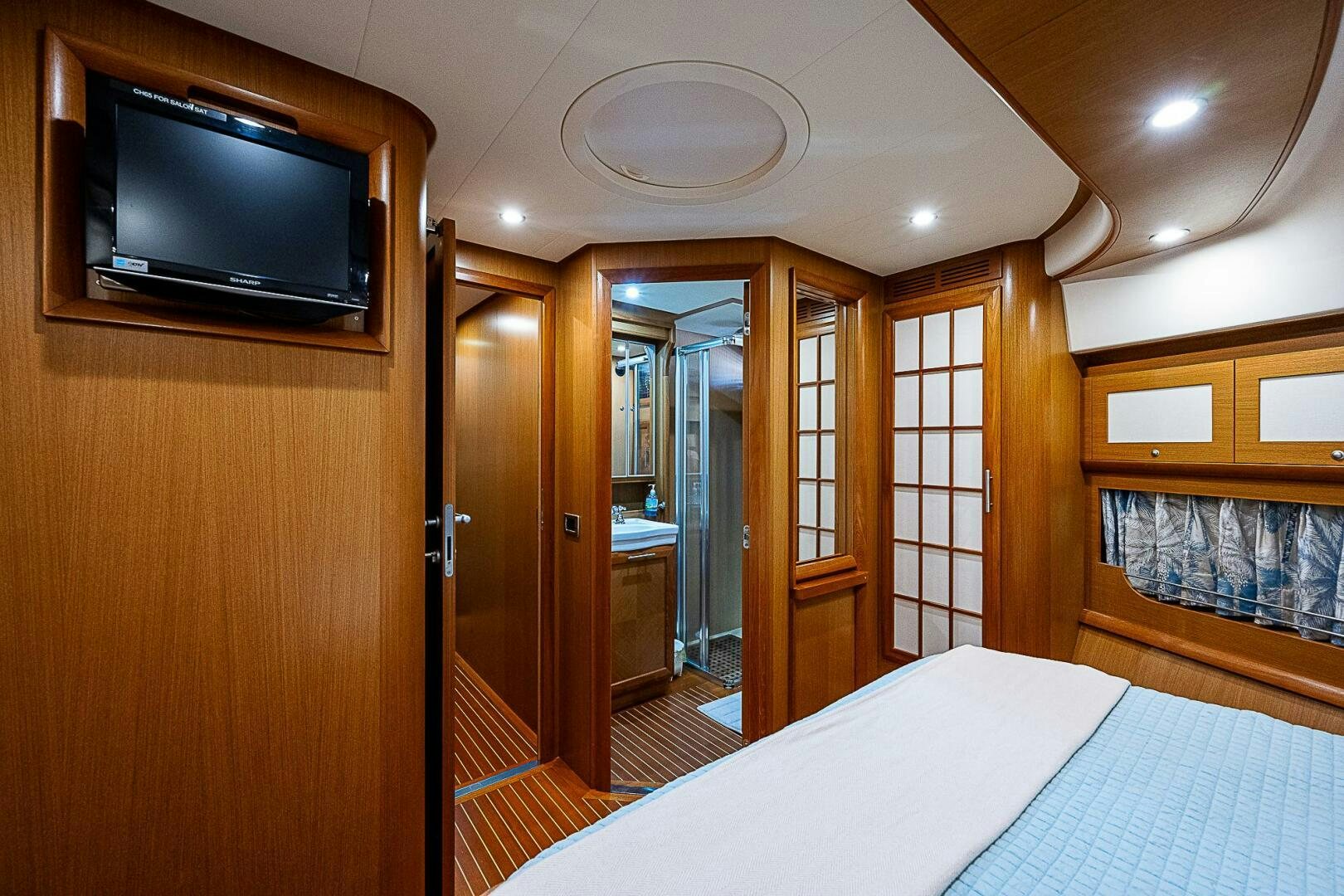 a hotel room with a tv and bed aboard KNOT NANNY'S Yacht for Sale