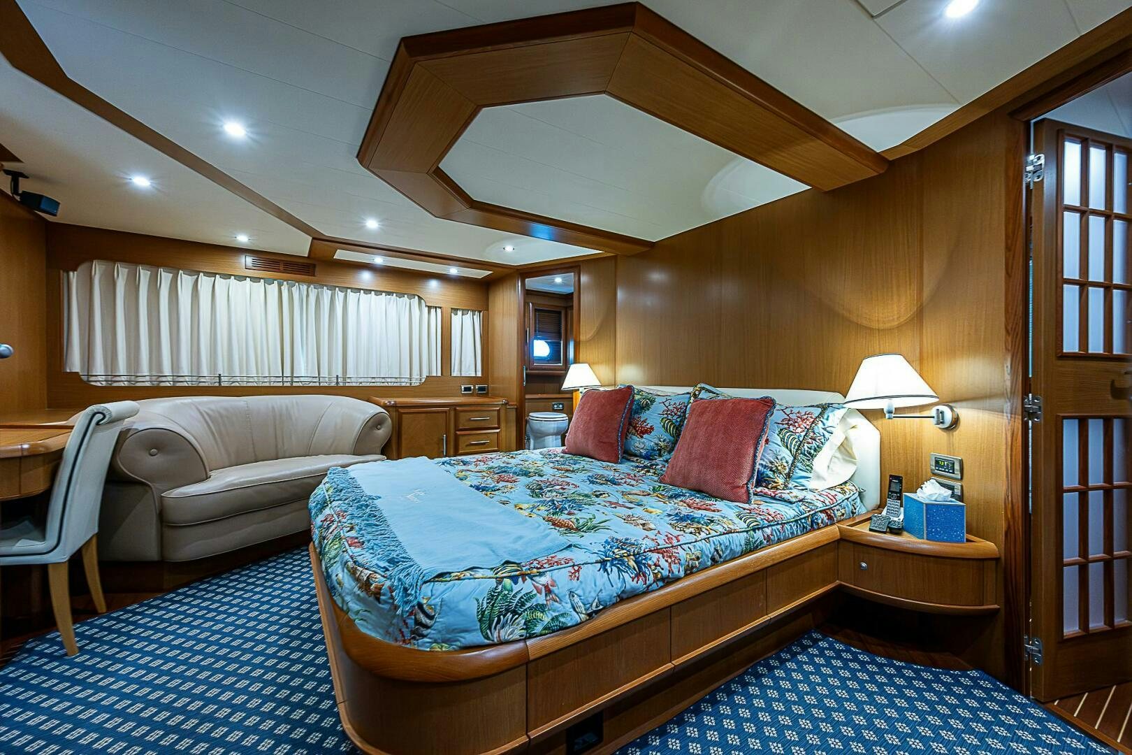 a bedroom with a bed and a couch aboard KNOT NANNY'S Yacht for Sale