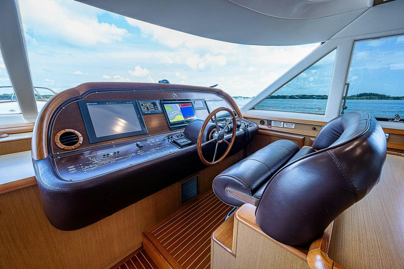 a leather seat with a steering wheel aboard KNOT NANNY'S Yacht for Sale