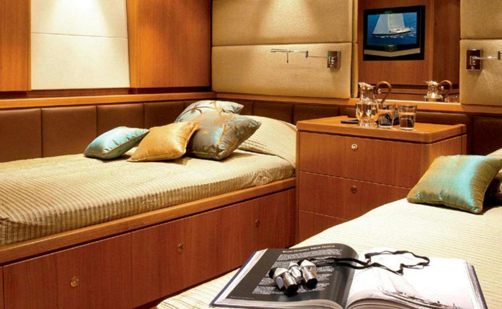 a bedroom with a bed and a desk aboard ARISTARCHOS Yacht for Charter