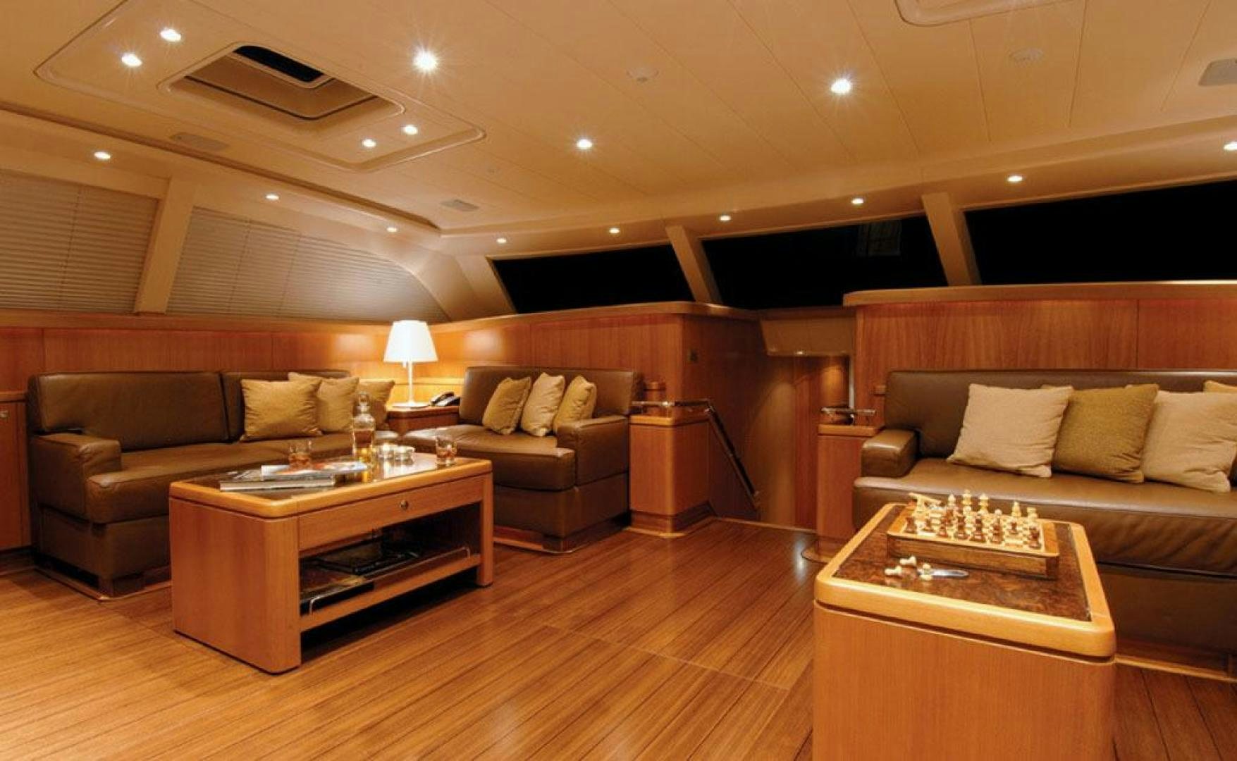a living room with a wood coffee table and a couch aboard ARISTARCHOS Yacht for Charter