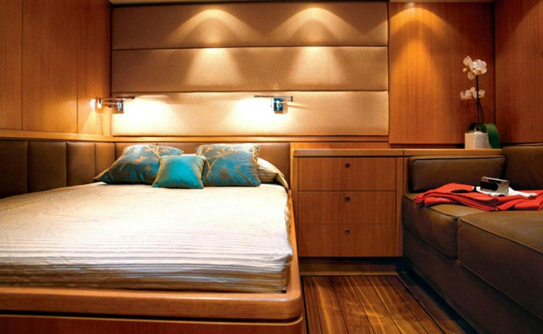 a bed with a white sheet and pillows aboard ARISTARCHOS Yacht for Charter