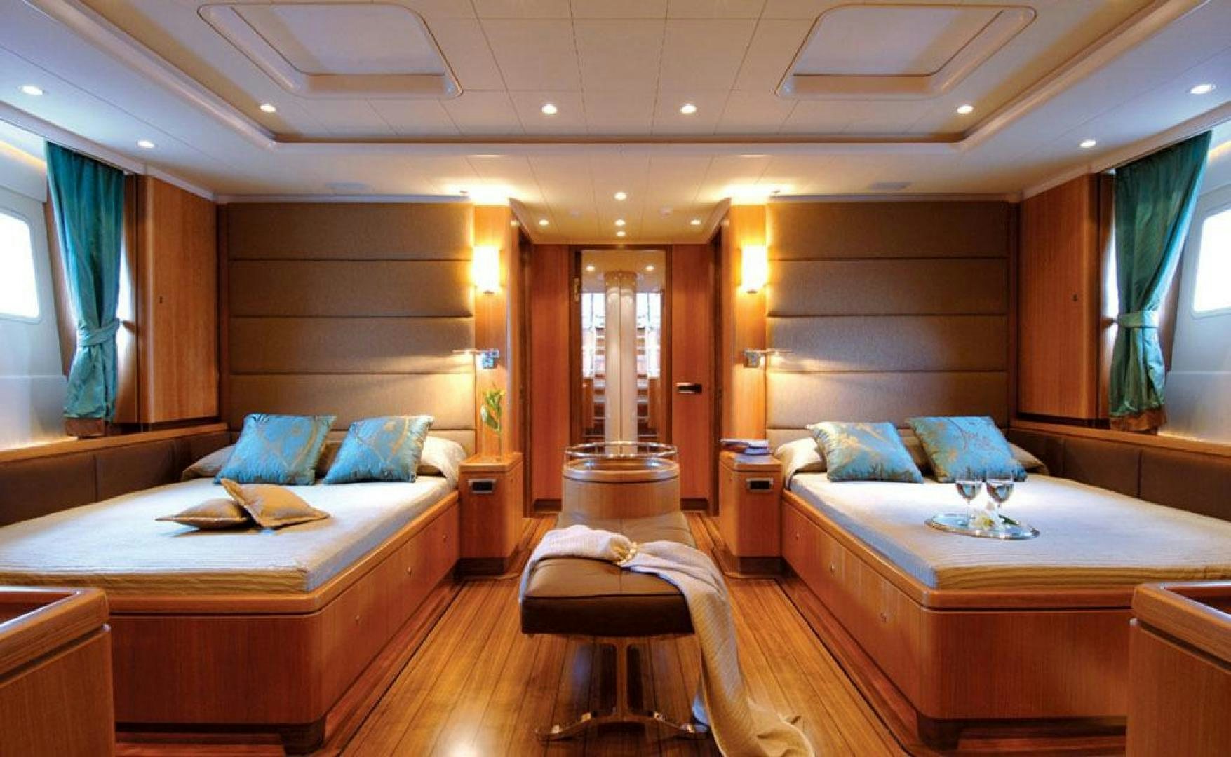 a room with two beds and a window aboard ARISTARCHOS Yacht for Charter