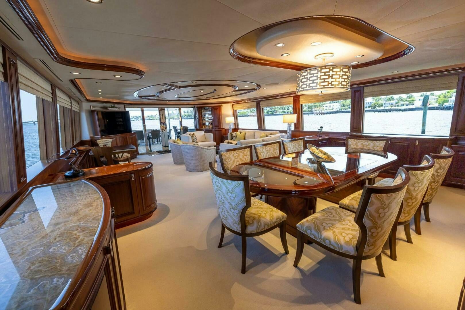 a large room with a table and chairs aboard SEAHAWK Yacht for Sale