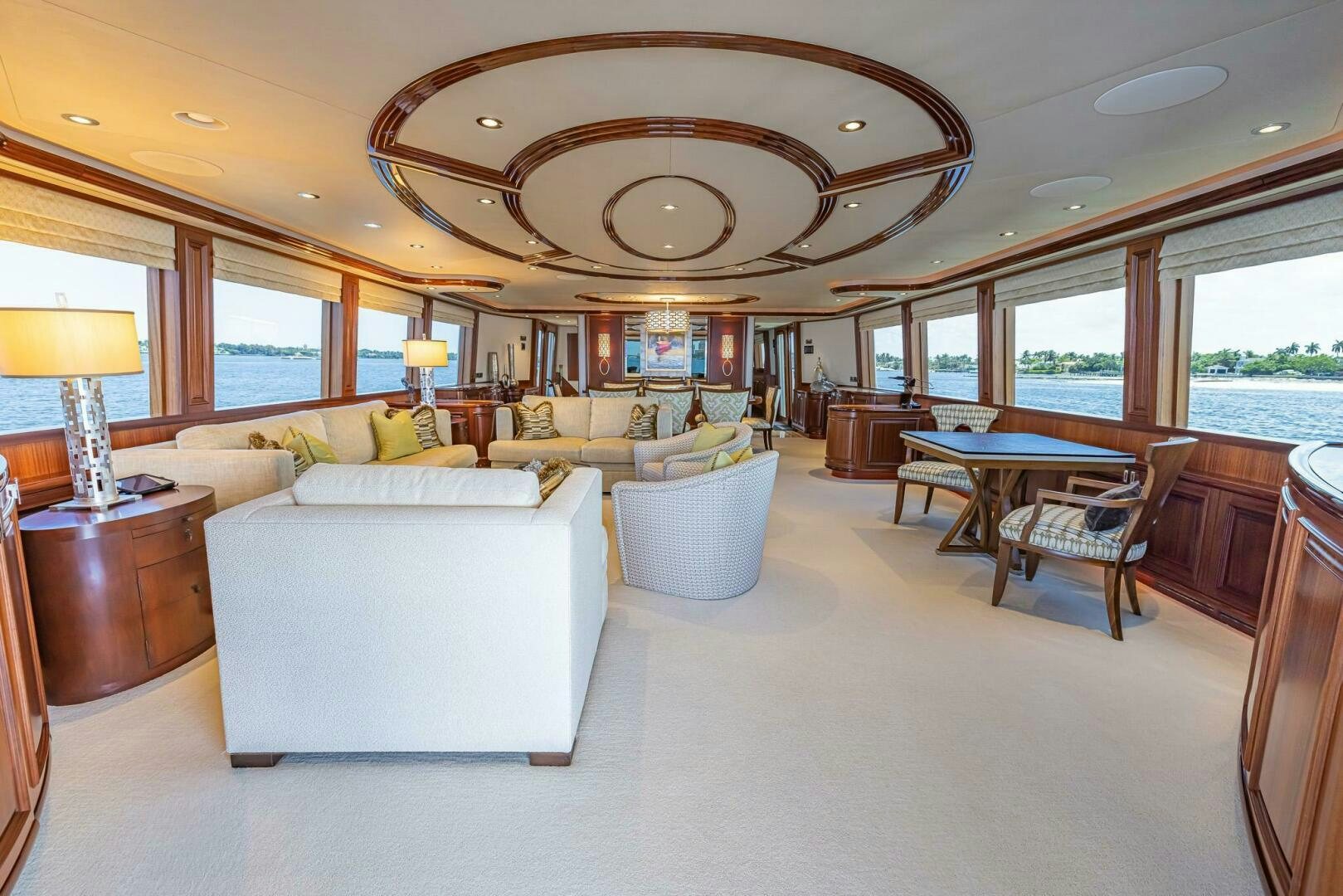 a large living room with a large chandelier aboard SEAHAWK Yacht for Sale
