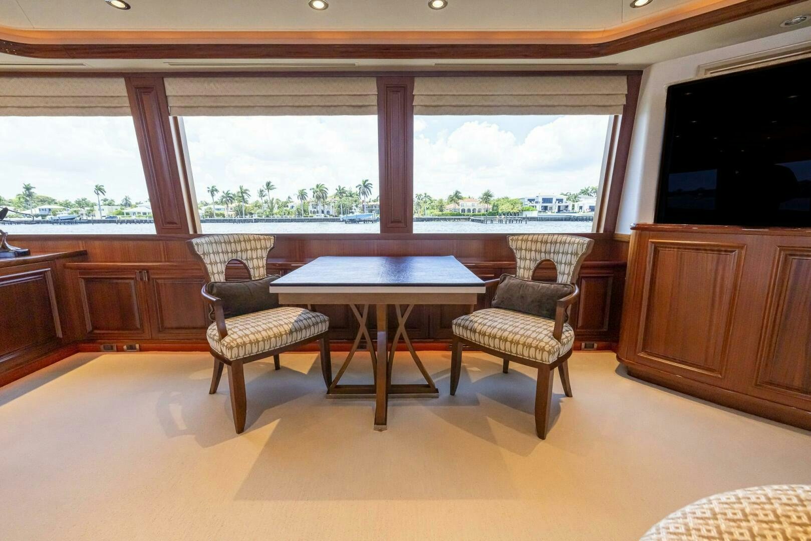 a room with a table and chairs aboard SEAHAWK Yacht for Sale