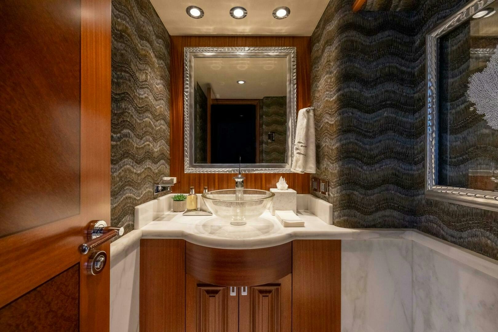 a bathroom with a sink and a mirror aboard SEAHAWK Yacht for Sale