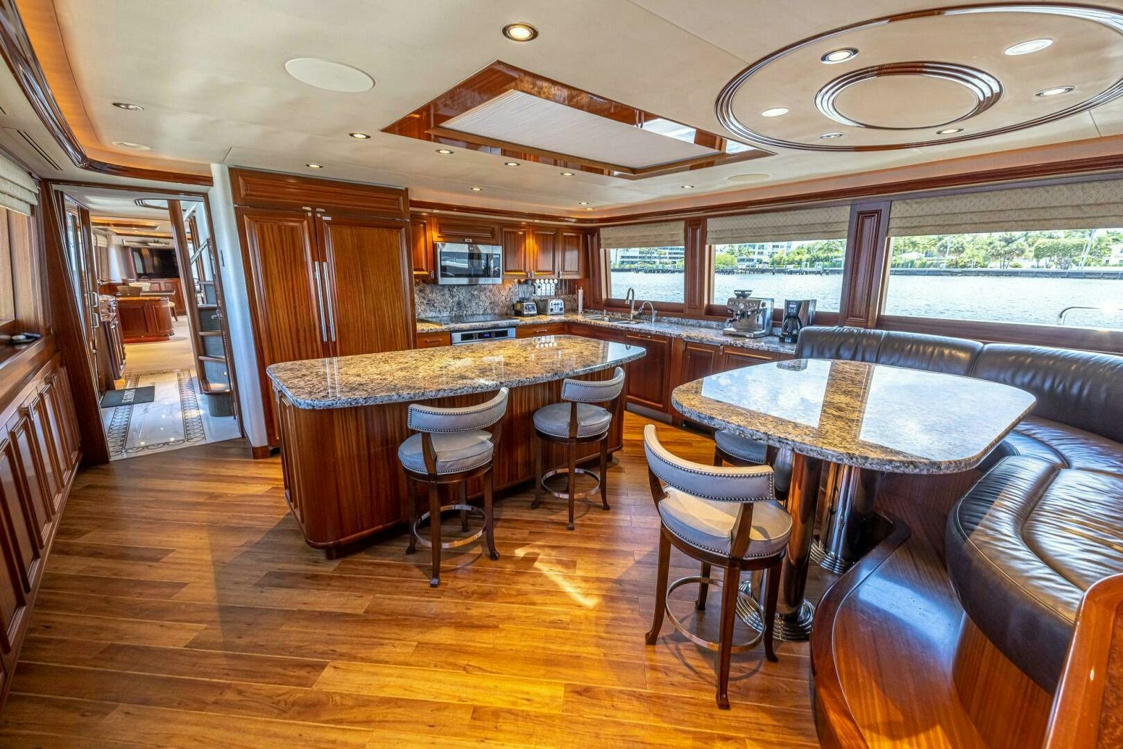 a kitchen with a table and chairs aboard SEAHAWK Yacht for Sale