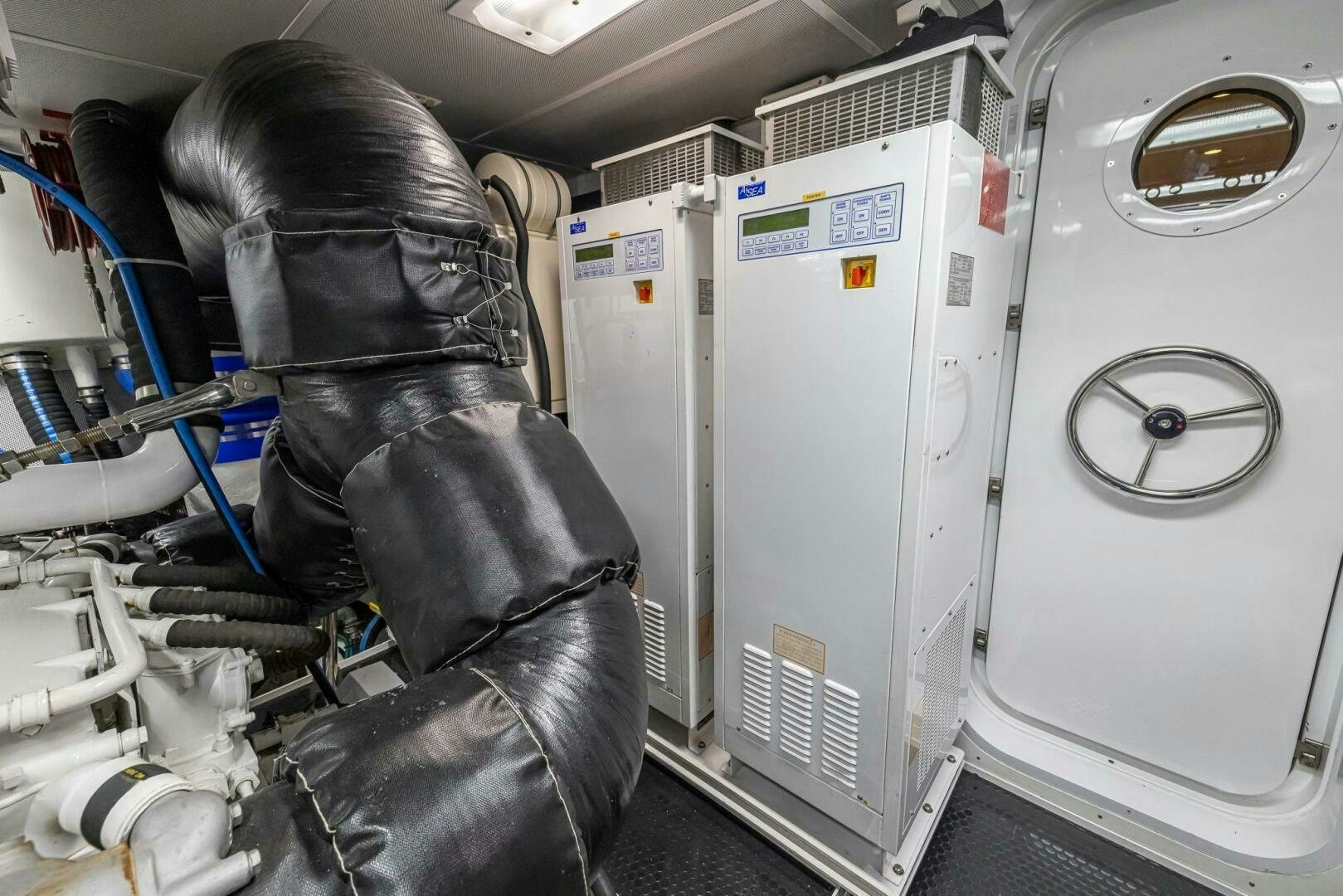 a person in a room with a machine aboard SEAHAWK Yacht for Sale