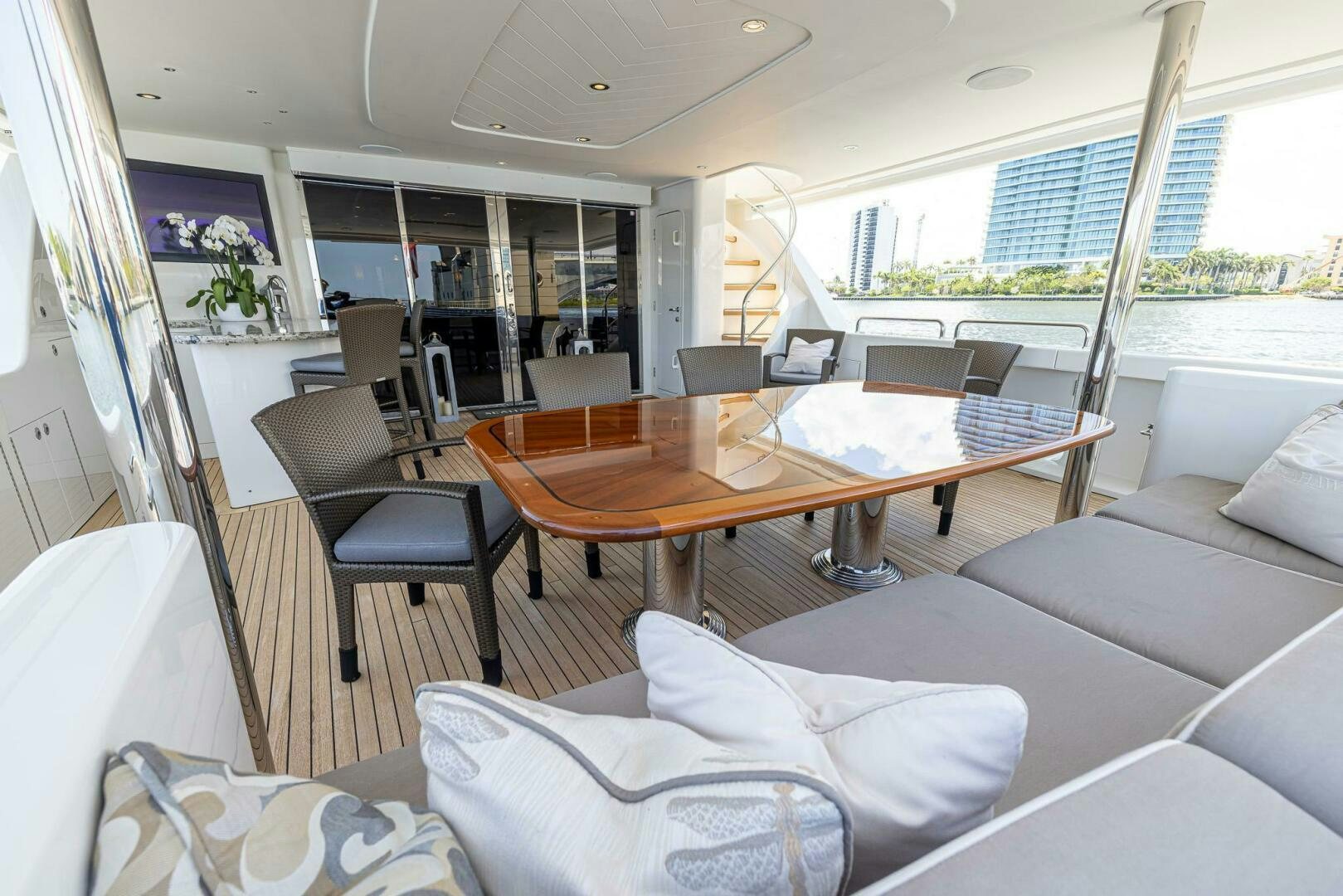 a room with a table chairs and a couch aboard SEAHAWK Yacht for Sale