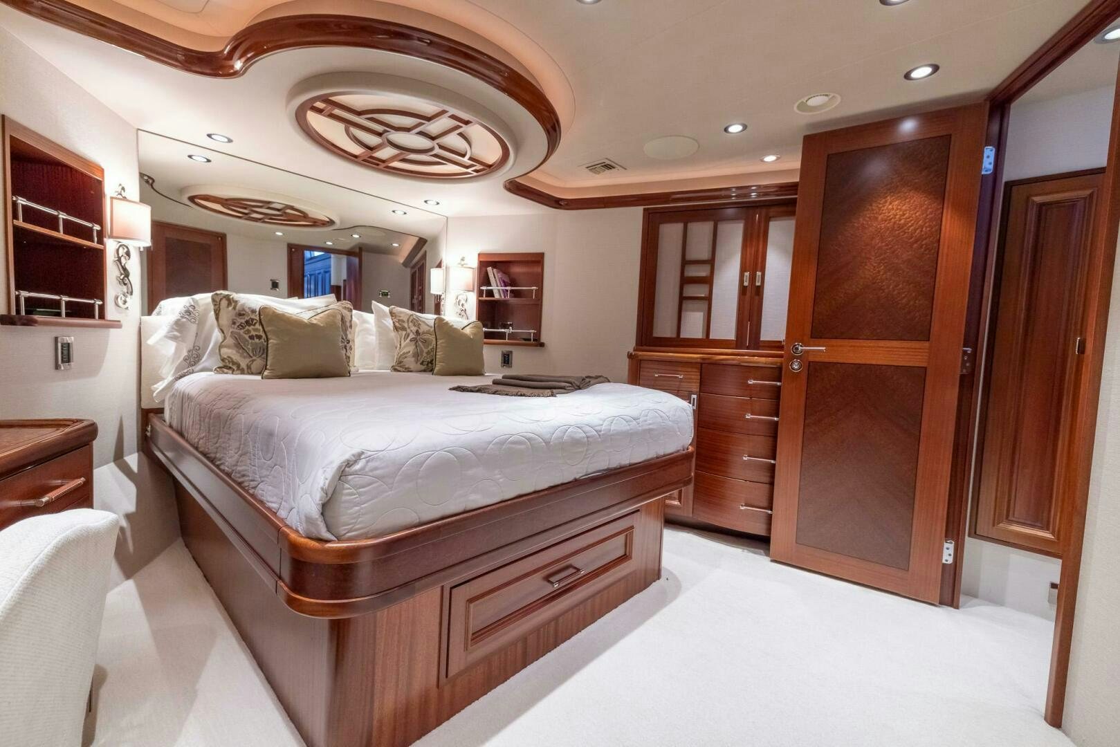 a room with a bed and a mirror aboard SEAHAWK Yacht for Sale