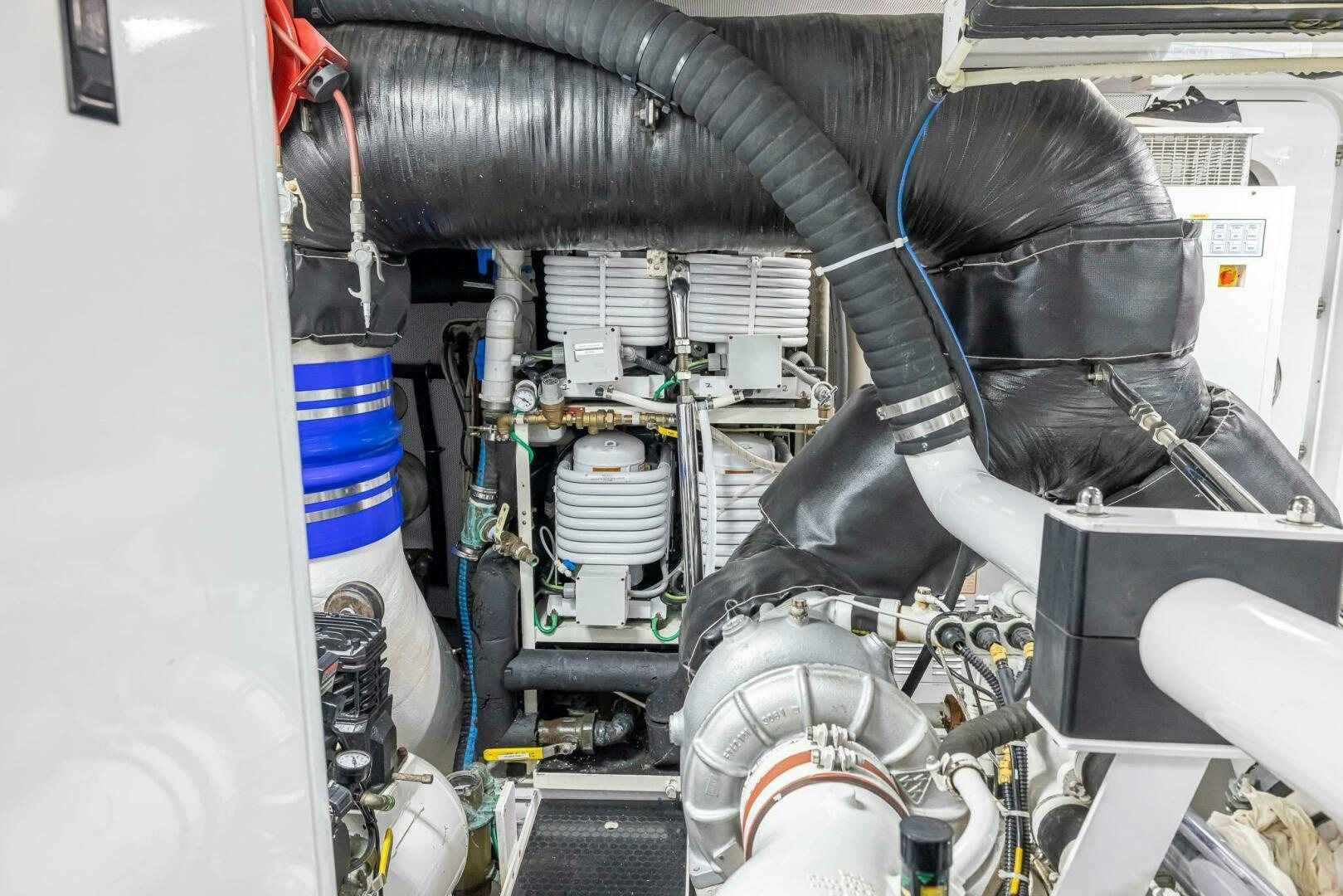 a person working on a car aboard SEAHAWK Yacht for Sale