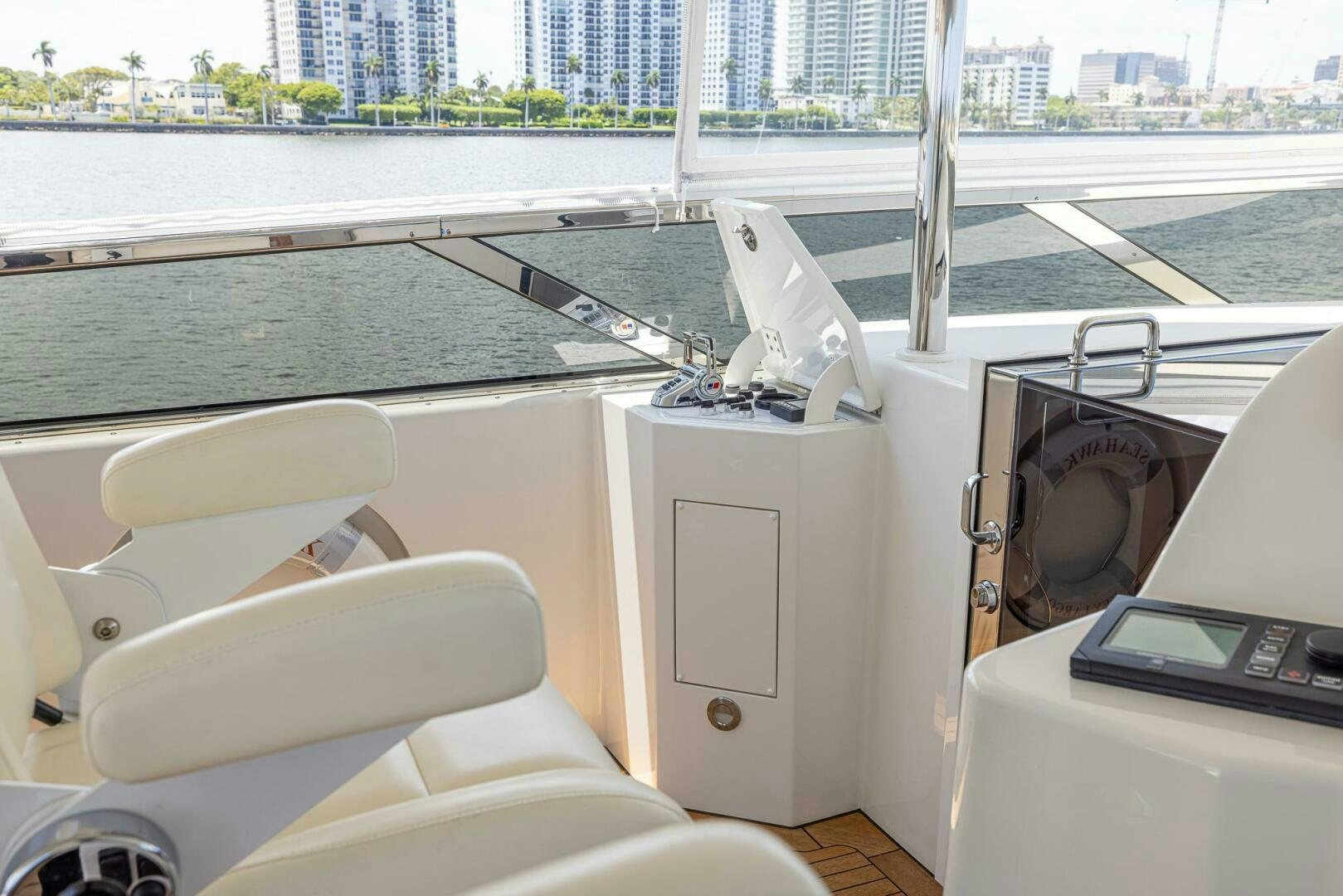a boat with a large deck and a large window aboard SEAHAWK Yacht for Sale