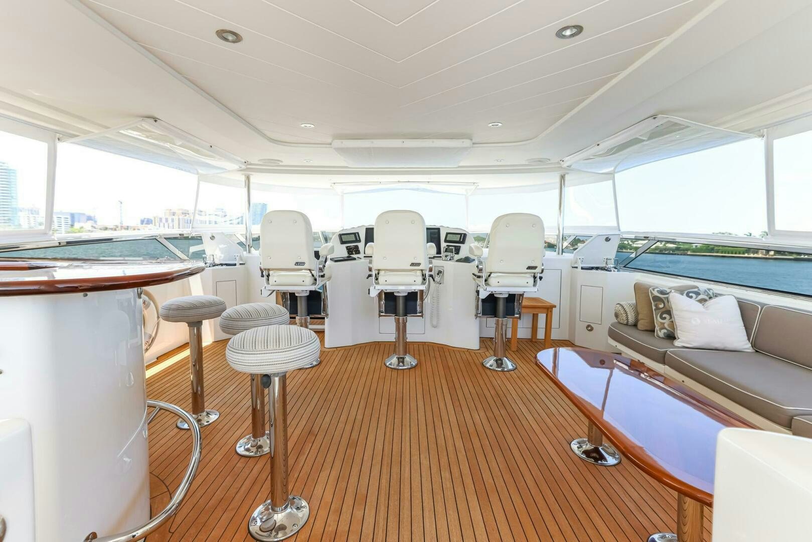 a room with a couch and chairs aboard SEAHAWK Yacht for Sale