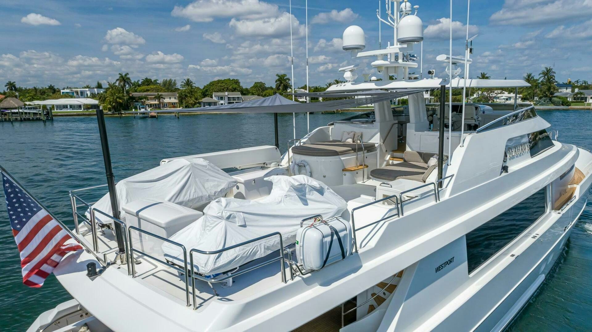 a boat with a flag on the front aboard SEAHAWK Yacht for Sale