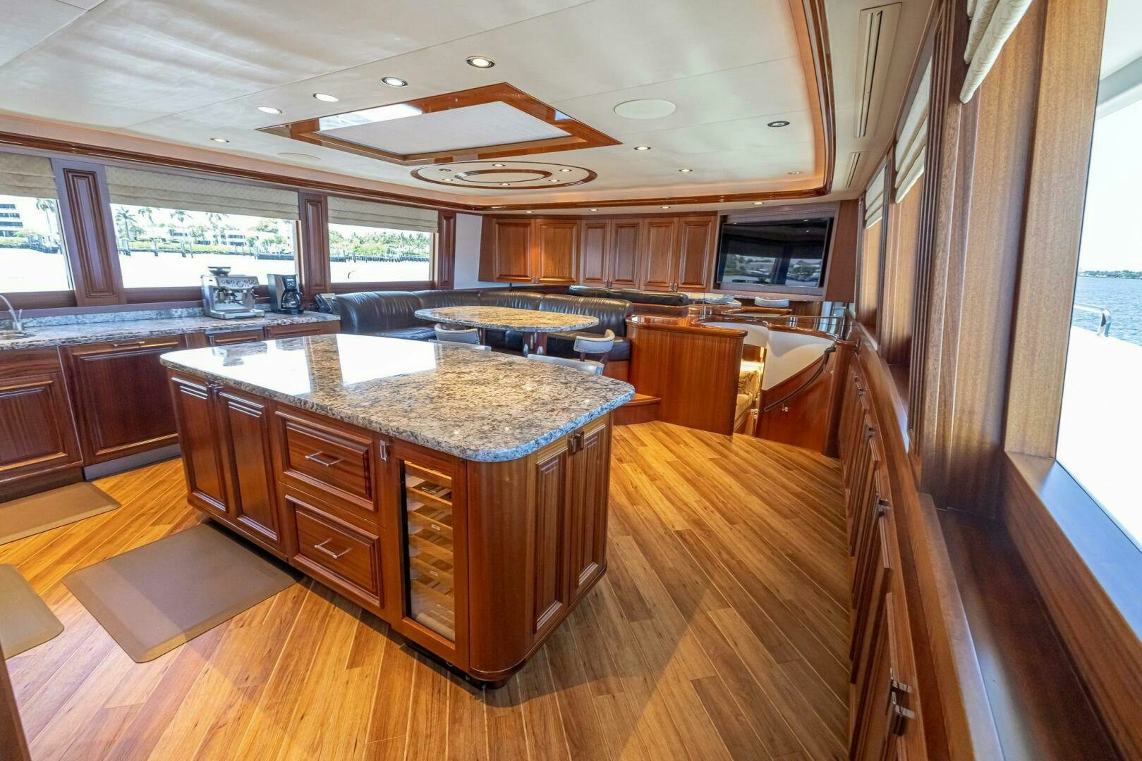 a large kitchen with wooden cabinets aboard SEAHAWK Yacht for Sale