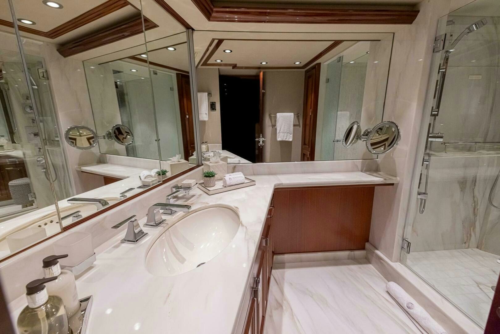 a bathroom with a large mirror aboard SEAHAWK Yacht for Sale