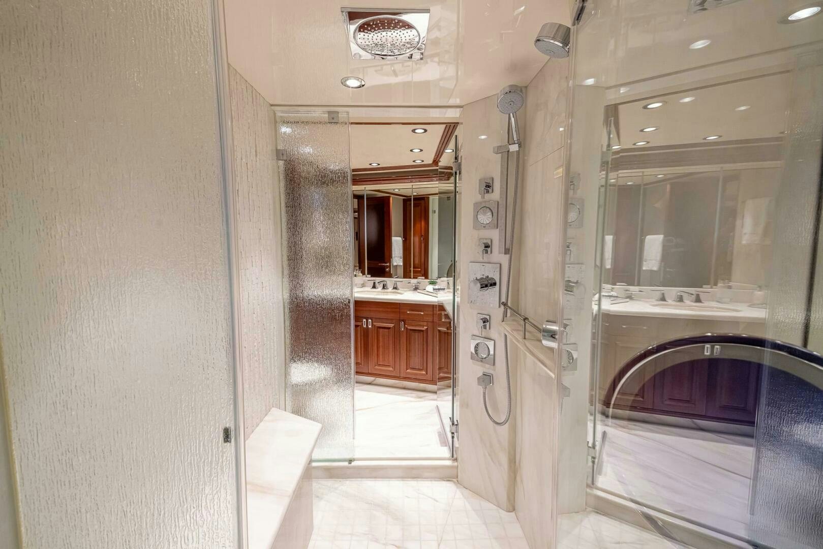 a bathroom with a sink and a shower aboard SEAHAWK Yacht for Sale