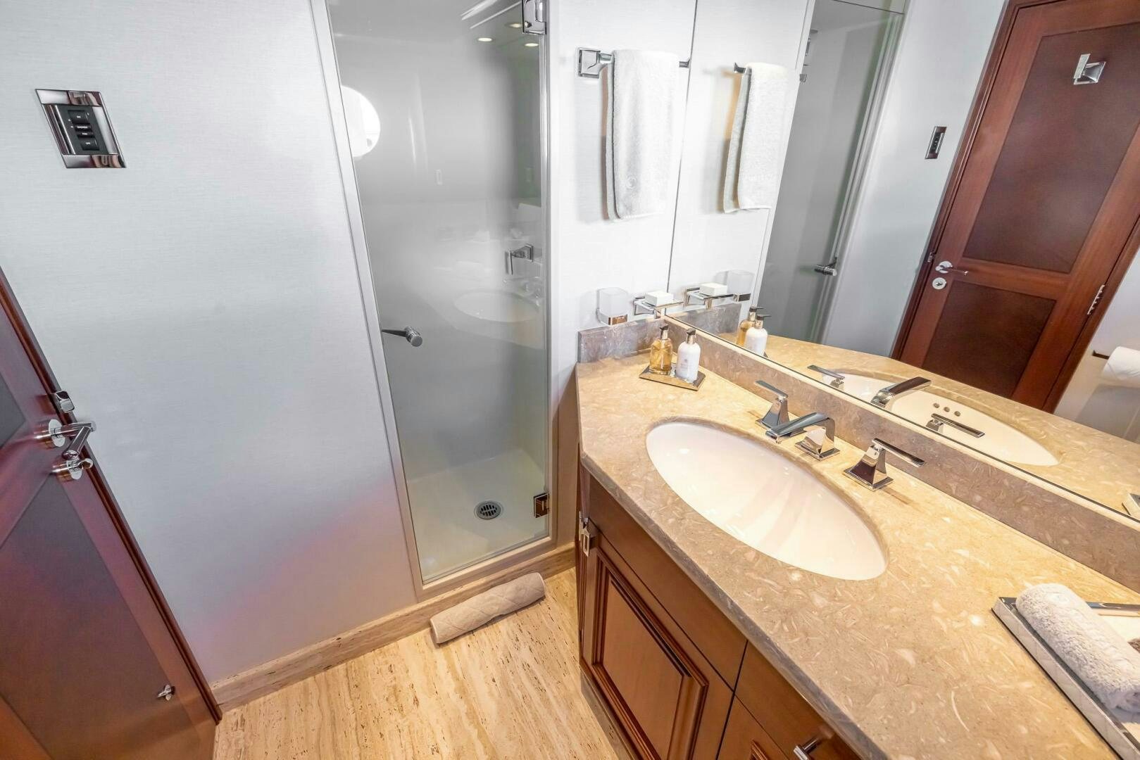 a bathroom with a countertop sink and mirror aboard SEAHAWK Yacht for Sale