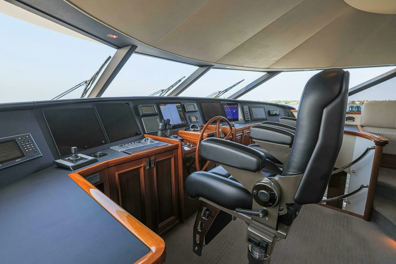 inside of a vehicle with a desk and chairs aboard SEAHAWK Yacht for Sale