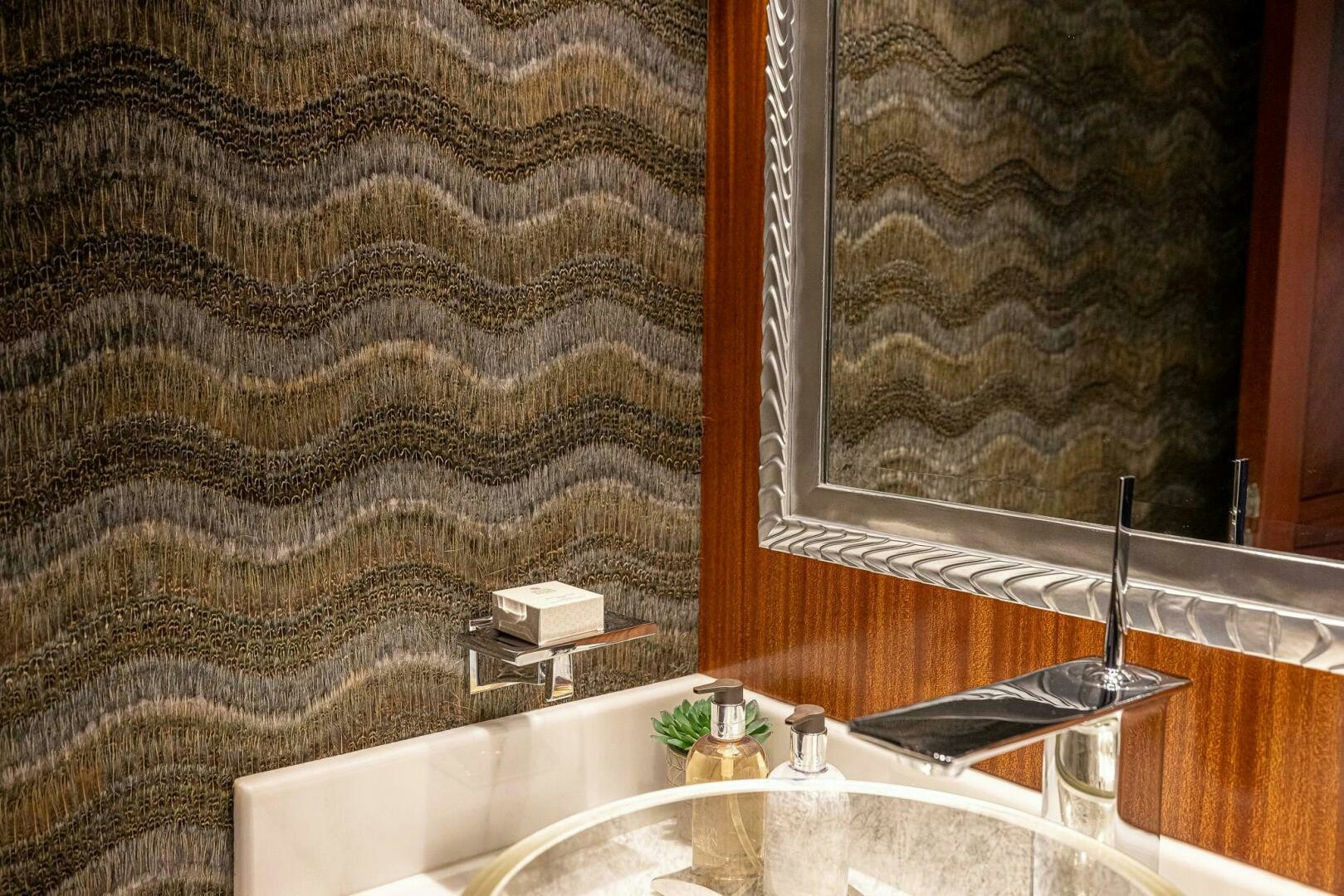 a bathroom with a large mirror aboard SEAHAWK Yacht for Sale