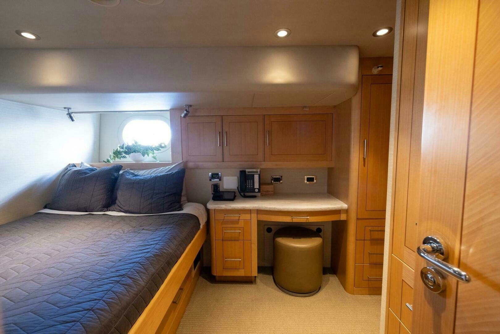 a bedroom with a bed and a sink aboard SEAHAWK Yacht for Sale