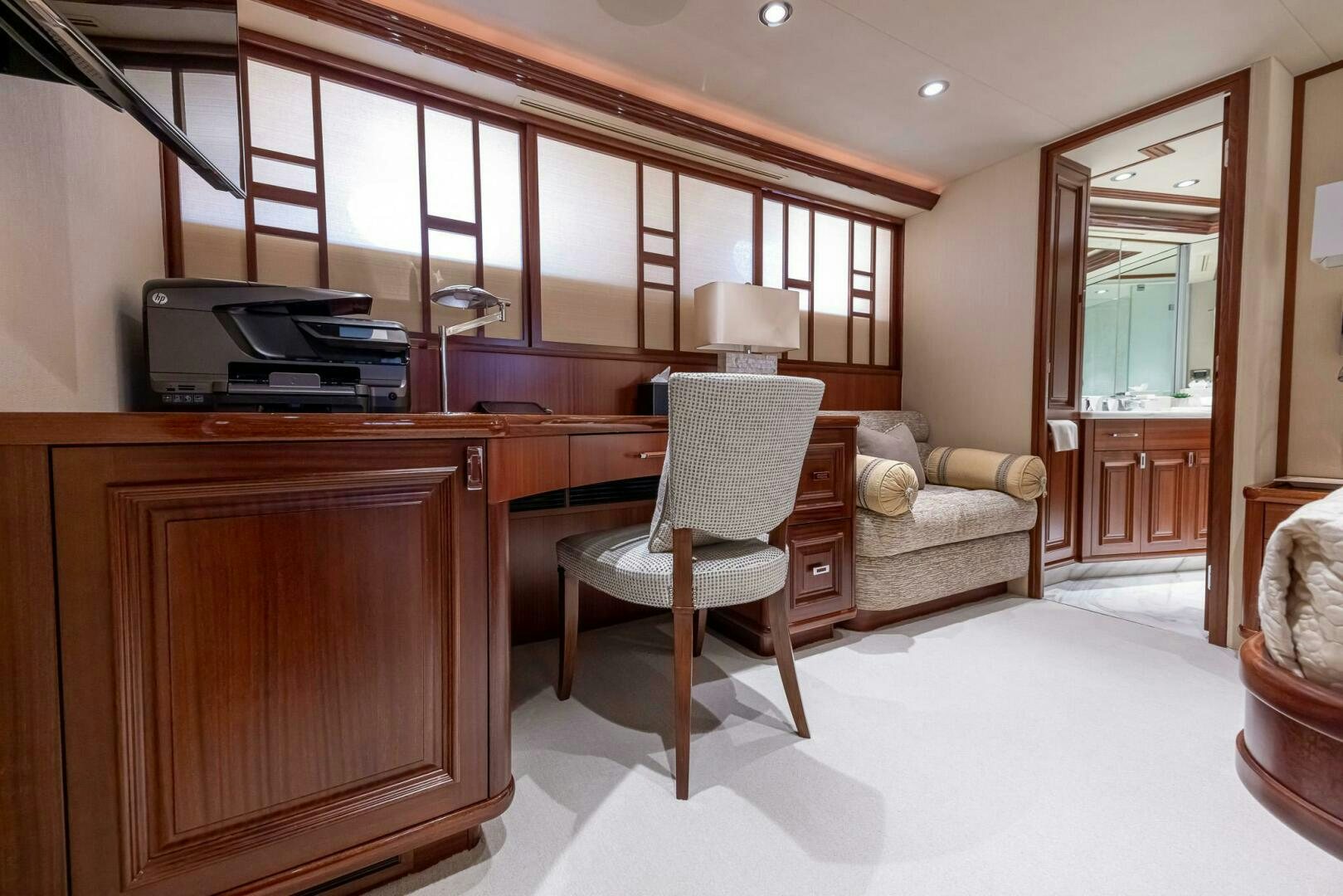 a living room with a television and a chair aboard SEAHAWK Yacht for Sale