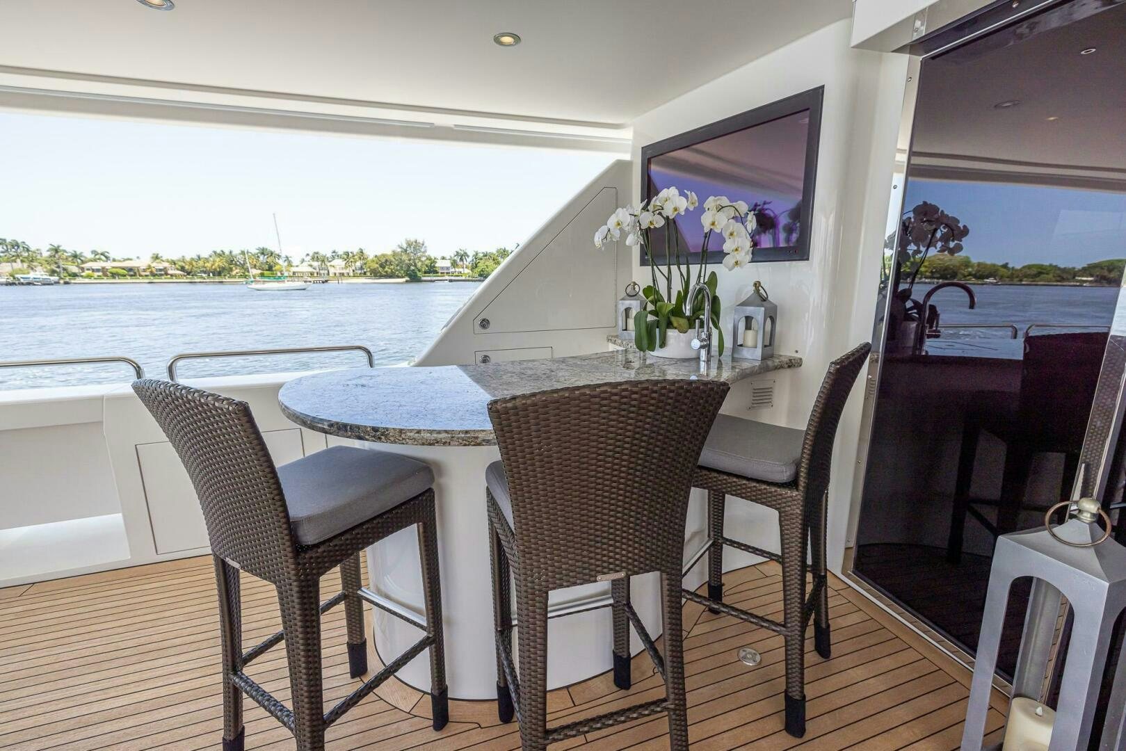 a table and chairs on a boat aboard SEAHAWK Yacht for Sale