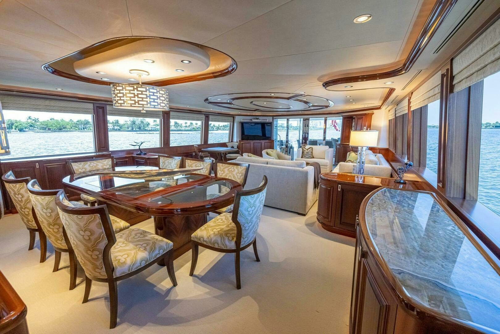 a living room with a table and chairs aboard SEAHAWK Yacht for Sale