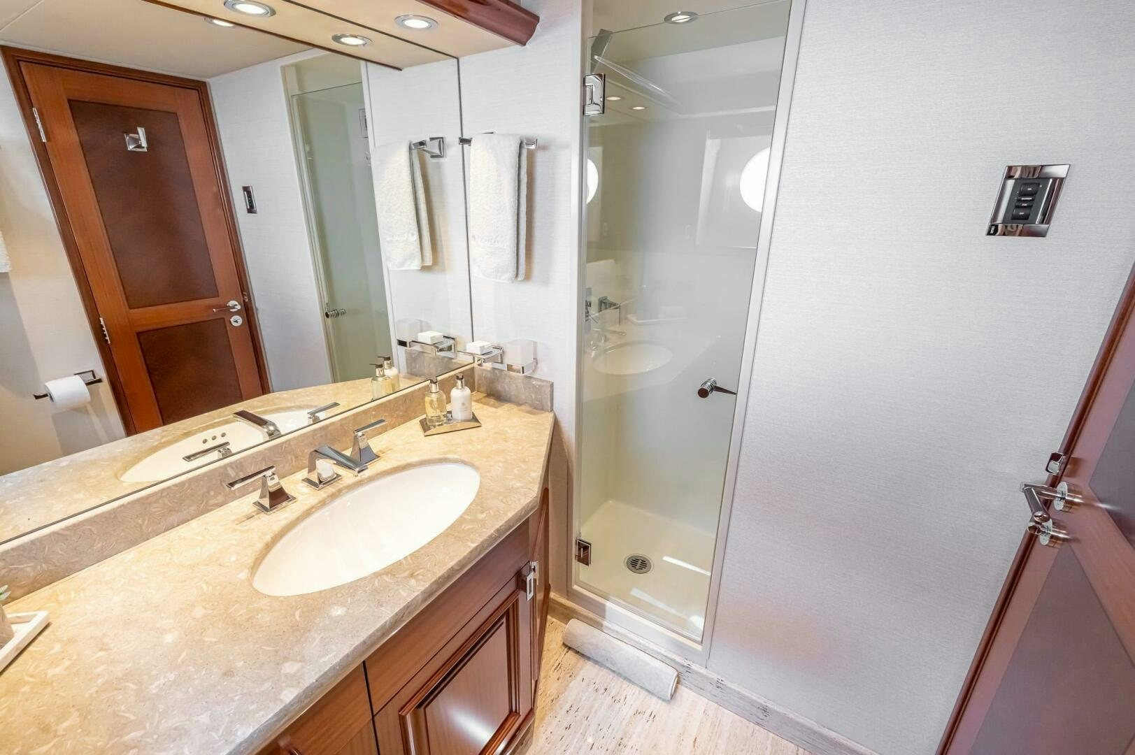 a bathroom with a countertop sink and mirror aboard SEAHAWK Yacht for Sale
