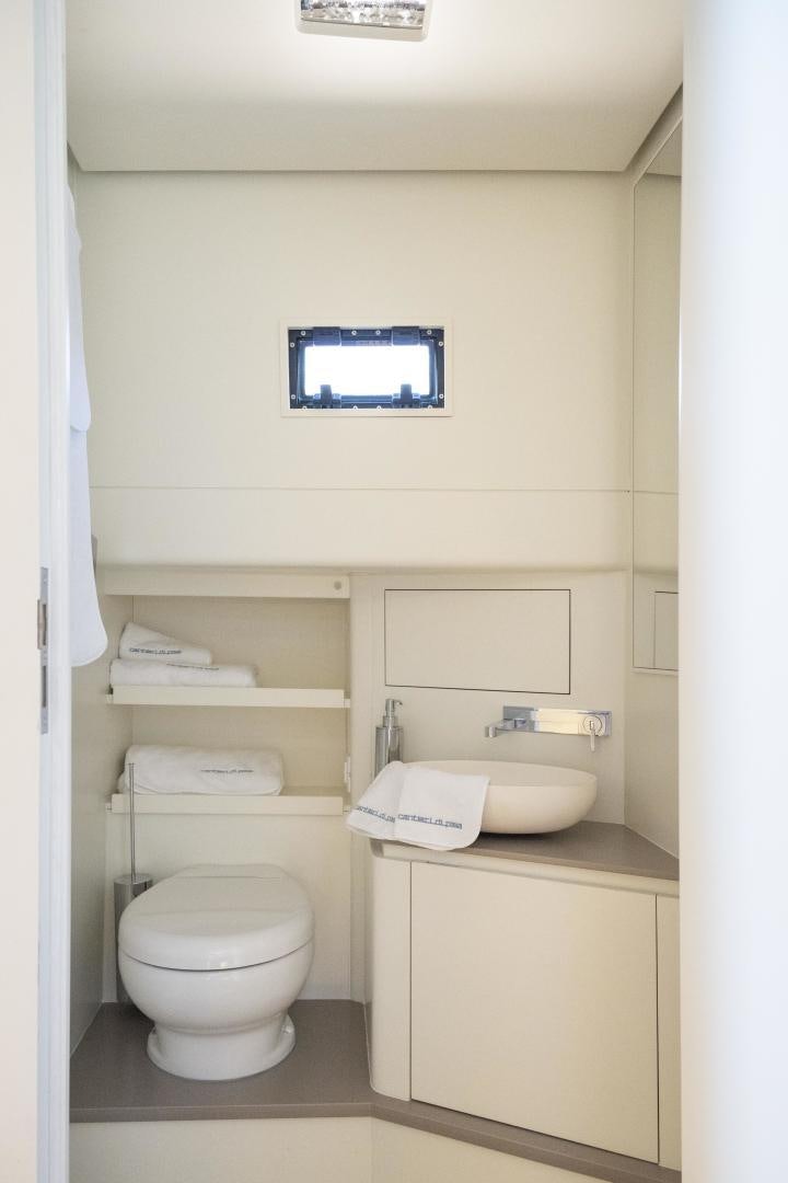 a small bathroom with a toilet and sink aboard CANTIERI DI PISA TENDER 50 Yacht for Sale