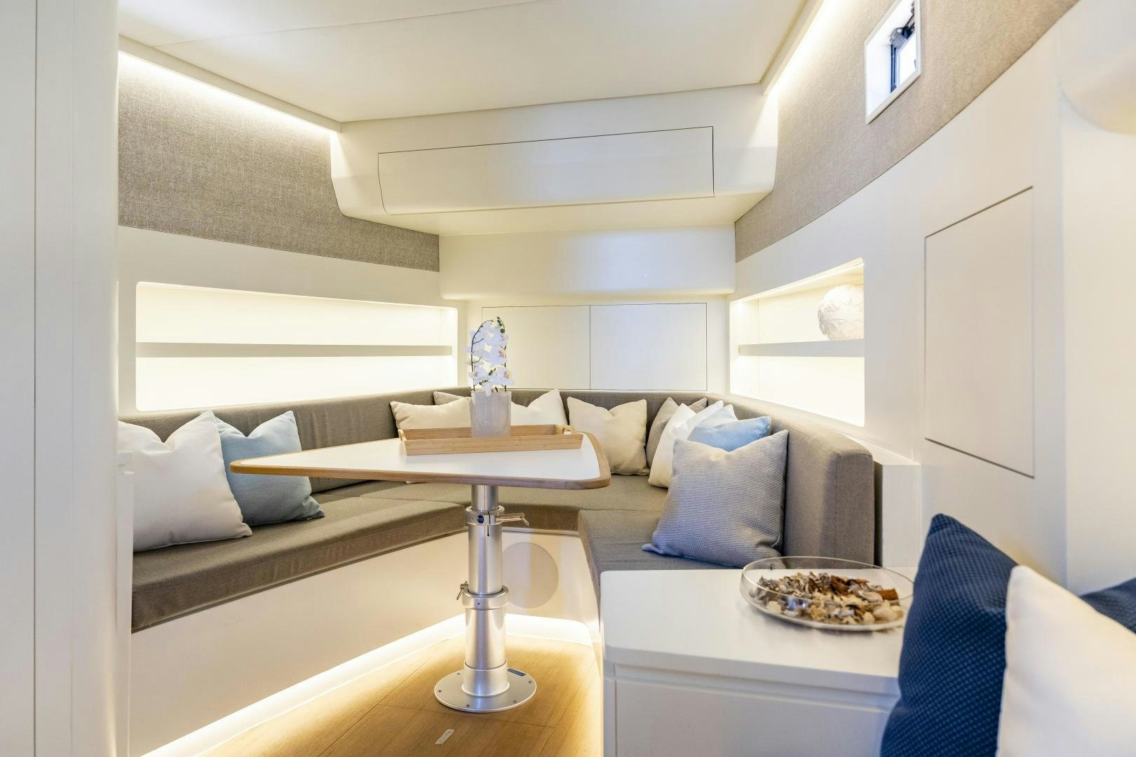 a room with a table and a plate of food aboard CANTIERI DI PISA TENDER 50 Yacht for Sale