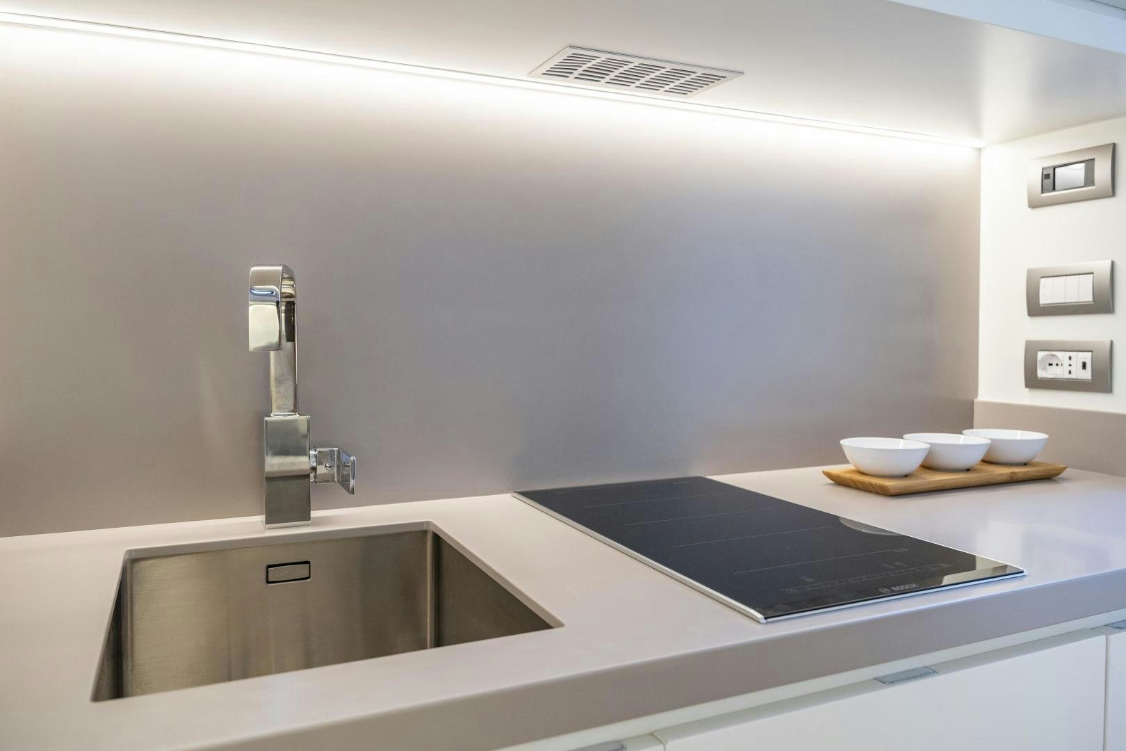 a kitchen with a large countertop aboard CANTIERI DI PISA TENDER 50 Yacht for Sale