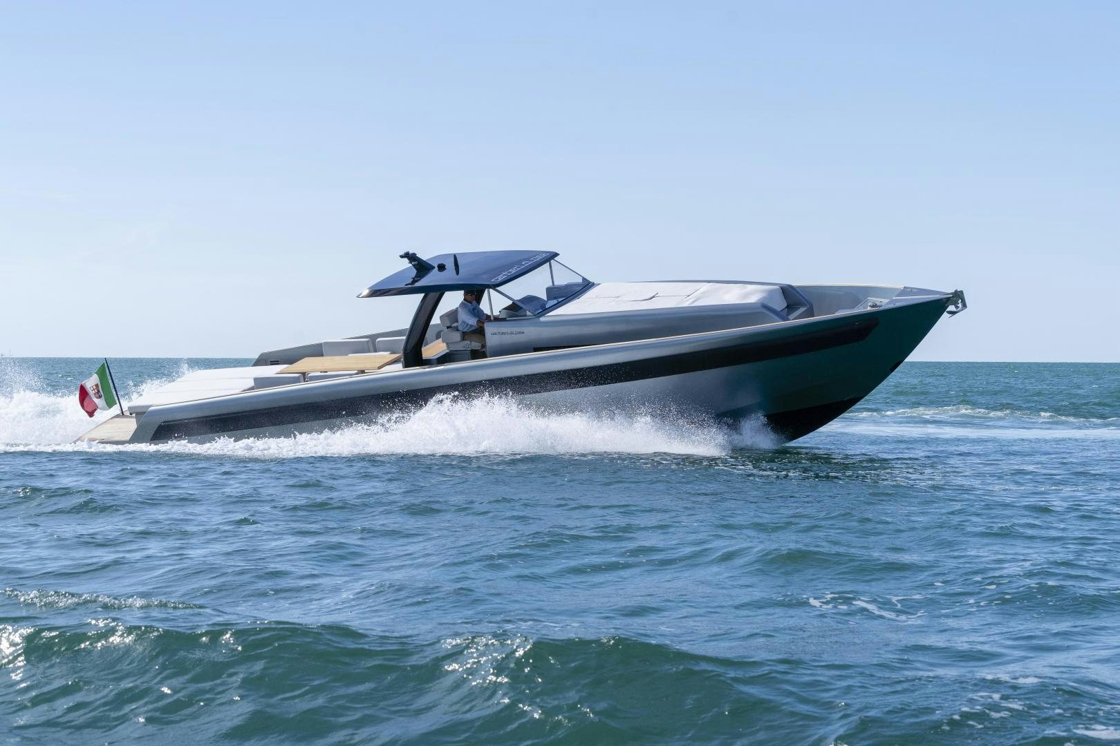 a man in a small boat aboard CANTIERI DI PISA TENDER 50 Yacht for Sale