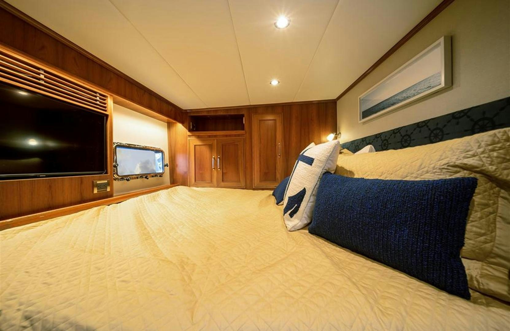 a bed with blue and white sheets aboard JULIANNE NAME RESERVED Yacht for Sale