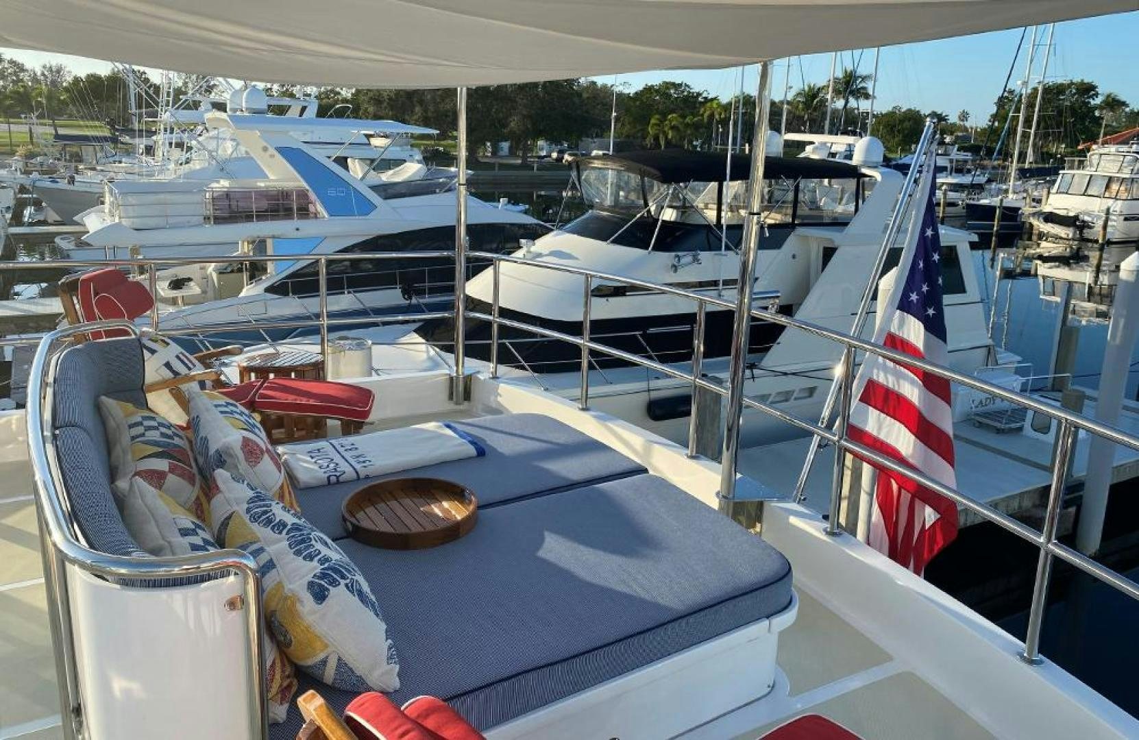 a boat with a flag on the front aboard JULIANNE NAME RESERVED Yacht for Sale