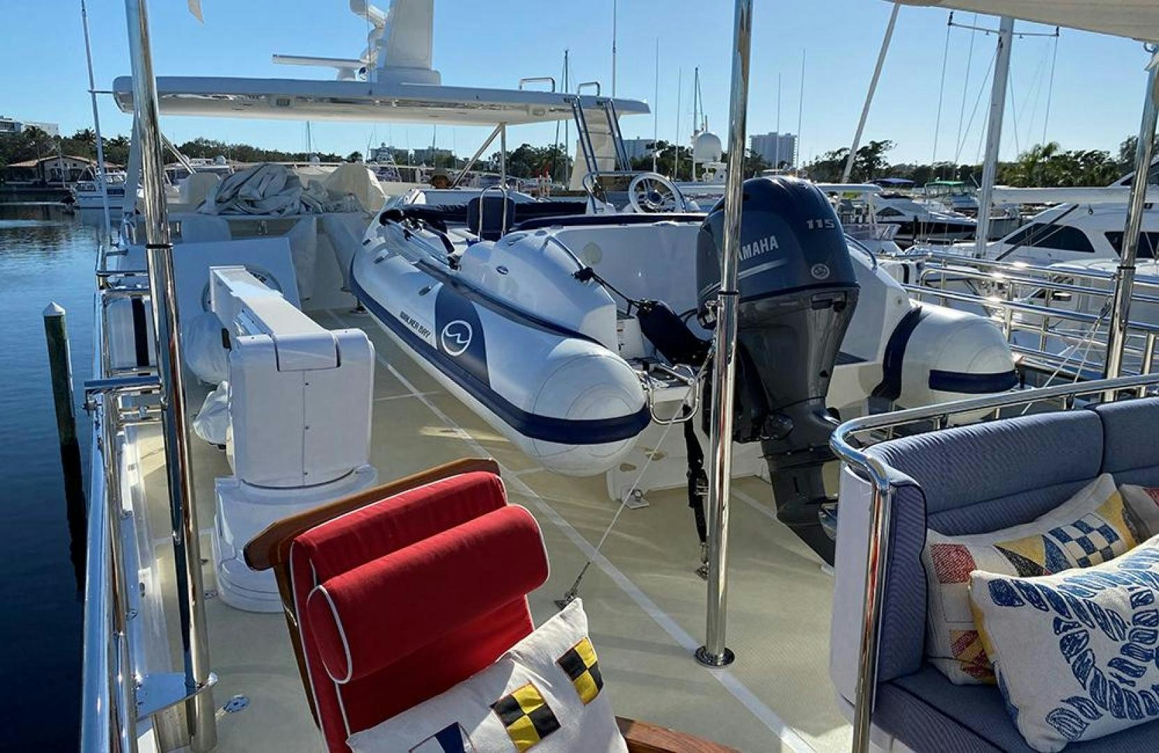 a boat with a chair on the deck aboard JULIANNE NAME RESERVED Yacht for Sale