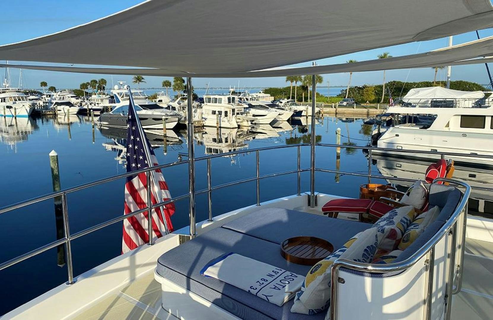 a boat with a flag on it aboard JULIANNE NAME RESERVED Yacht for Sale