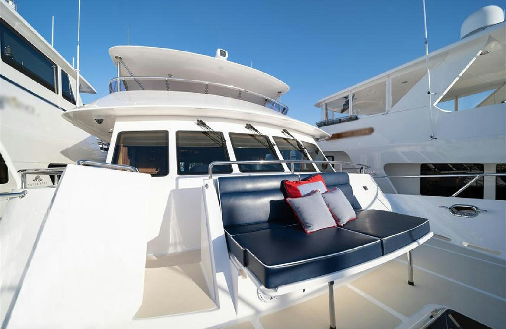 a white yacht with a red seat aboard JULIANNE NAME RESERVED Yacht for Sale