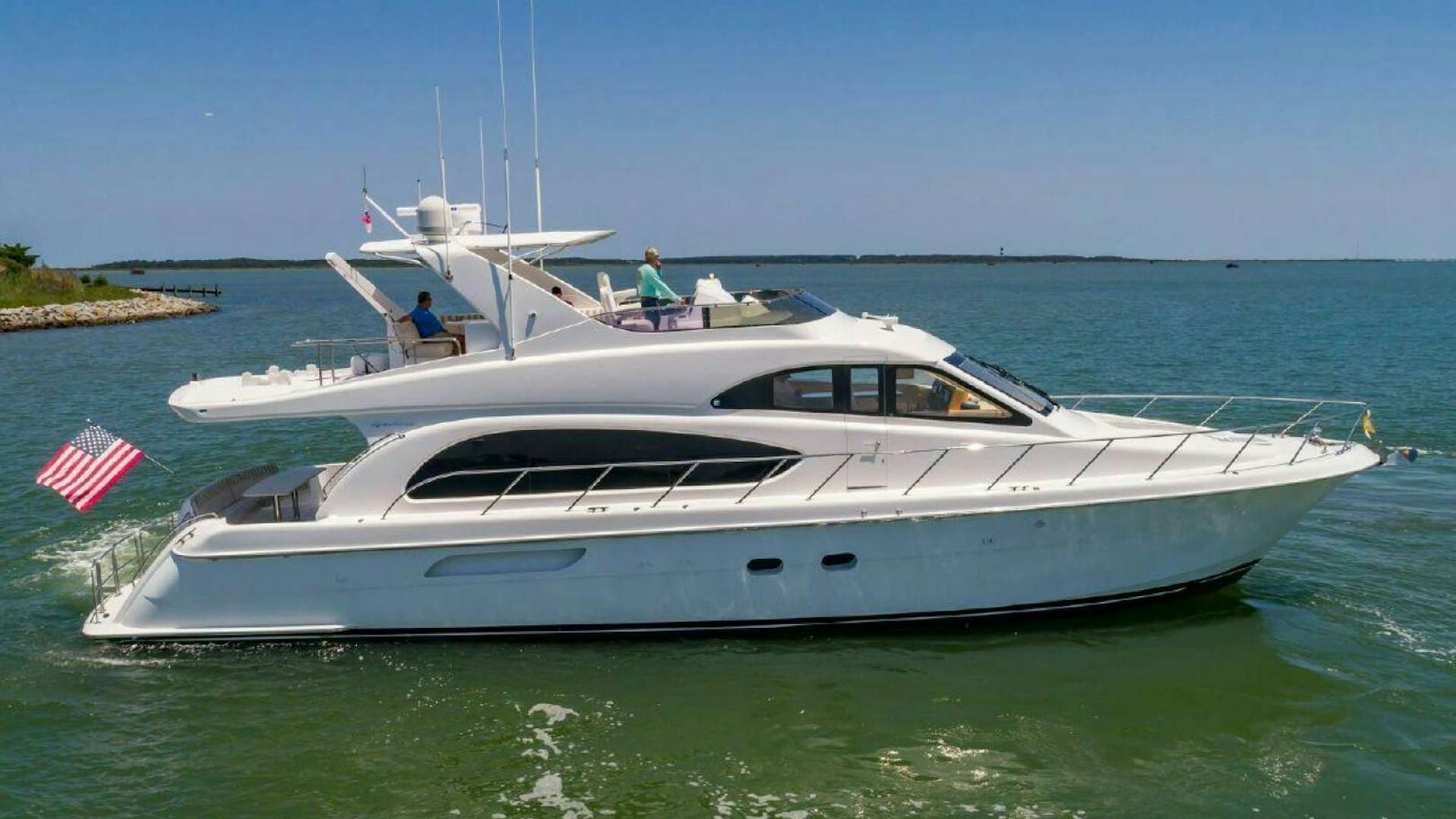 a white yacht on the water aboard SIMPLE MAN Yacht for Sale