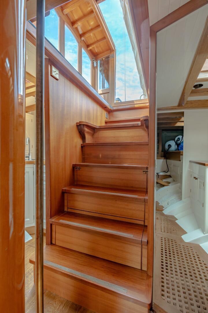 a wooden staircase with a wood frame aboard ARMIDE Yacht for Sale