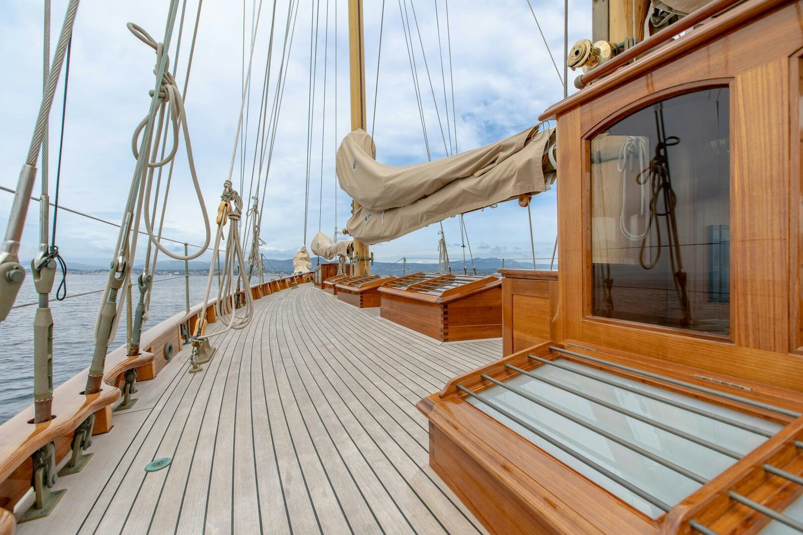 a wooden boat on a deck aboard ARMIDE Yacht for Sale