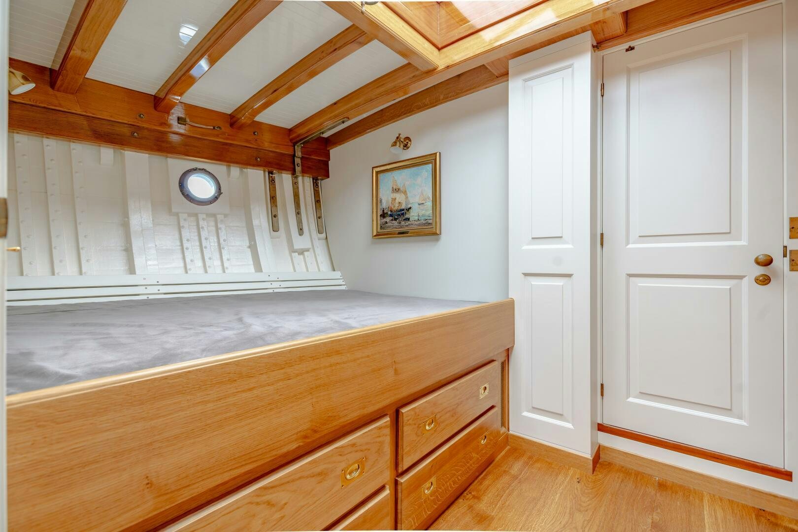 a large wooden room with a large wooden staircase aboard ARMIDE Yacht for Sale