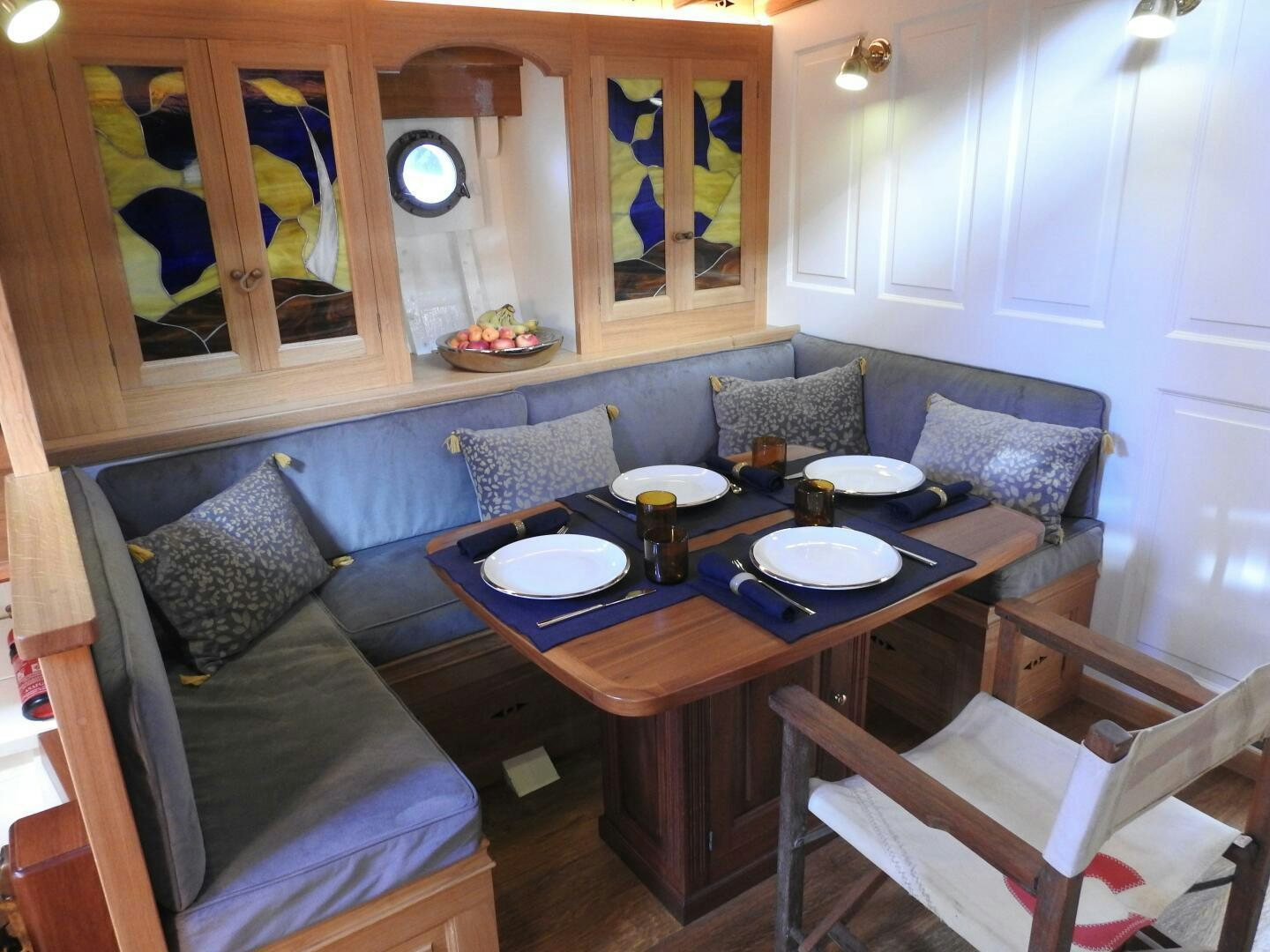 a dining table in a living room aboard ARMIDE Yacht for Sale